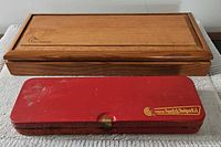Wooden Ducks Unlimited case and red Gunslick metal box closed