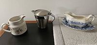 Three main items: cream pitcher, Kuradori thermal gravy boat, blue-and-white gravy boat on underplate