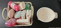 Overview of basket with assorted soaps and separate shaving mug