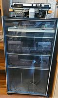 Stereo cabinet with Kenwood receiver, cassette deck and Technics turntable, plus reel deck on top