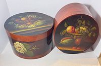 Both lacquered pantry boxes showing size and artwork