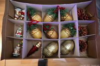 Boxed set showing all ornaments in compartments