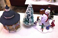 Gazebo, bottle-brush tree and snowman accessory set displayed together