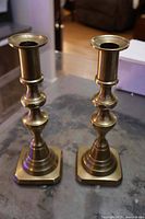 Front view of both brass candlesticks
