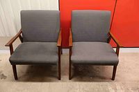 Front view of both grey walnut armchairs