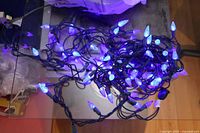 Both strings powered on, showing blue LEDs lit on green wire