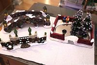 Overview of all three Christmas village pieces: bridge, gate, pond