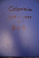 Front cover of blue album marked "Colombia 1859-1999 + B.O.B."