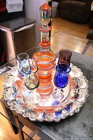 Full set showing decanter, four coloured glasses, and tray