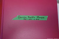 Front of magenta binder with handwritten label Dominican Republic Stamps 1865-1993 + B.O.B.