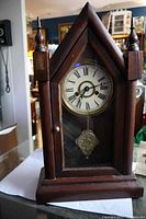 Full view of wood steeple mantel clock