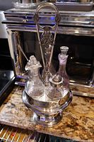 overall view of cruet stand with four bottles