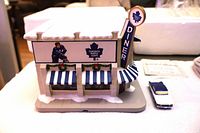 Front angled view of diner building and 1959 Buick car