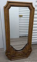 Front view of oak framed wall mirror
