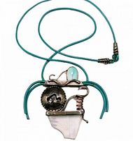 Full view of necklace showing pendant and leather cord