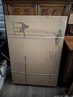 Front of sealed carton showing product outline of hoop system