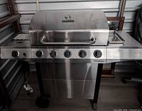 Front view of Char-Broil Performance stainless grill with side burner