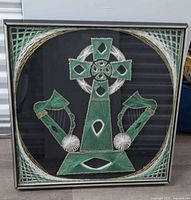 Full view of framed Celtic cross and harps string art