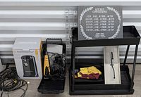 Overall lot: Toastmaster box, Wahl kit, cables, sign, stand