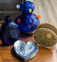Group shot showing vase, flask bottle, bookends and heart dishes