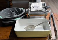 All items together: pasta machine, casserole dish, silicone pans, tongs, spoon