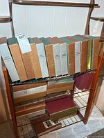 Front view showing two shelves of slipcased booklet sets