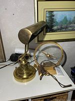 Lamp and clock on tabletop showing overall appearance
