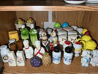 Full shelf view of assorted salt and pepper shakers