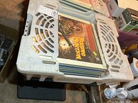 Top view of crate showing multiple CED discs, Missing in Action visible