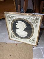 Front view of framed cameo wall art