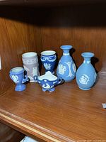 All six ceramic pieces on shelf