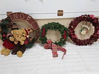 Three wreaths side by side showing overall design and relative sizes