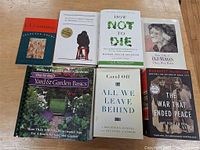 Seven books laid out showing front covers and titles