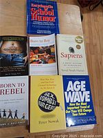 All seven books laid out, titles visible