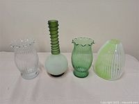 All four vases front view