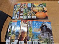 All twelve Harrowsmith Country Life magazines fanned out on tabletop