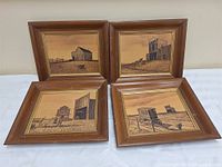 All four framed wooden farm scene art pieces displayed together