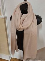 Scarf draped on mannequin showing full length and color