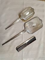 Full view of mirror, brush and comb