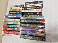 Stacked view showing horizontal row including E.T., Hook, Seabiscuit, The Santa Clause, Remember the Titans, The Night They Saved Christmas, Pooh’s Grand Adventure and bottom row with The Jungle Book, The Hunchback of Notre Dame, The Lion King, National Velvet.