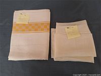 Both folded fabrics side by side showing relative sizes