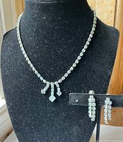 necklace on bust form with matching earrings