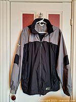 Front view of jacket hanging, showing colour and style