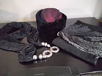 Overall lot showing hat, infinity scarf with silver accents, folded gauze scarf