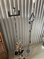 Two chrome floor lamps and one table lamp bases