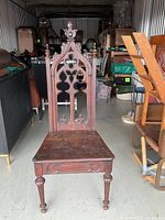 Full view of carved wooden chair front