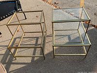 Both brass and glass tables side by side