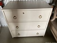 Front view showing entire dresser and drawer pulls