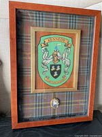 Full view of framed Kennedy tartan crest art