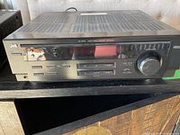 Front view of JVC RX-6010V receiver showing display, controls and branding